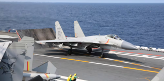 China unveils amphibious assault ship that can launch fighter jets